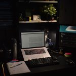 a laptop sits on a desk
