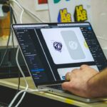 Person designing on a laptop computer screen