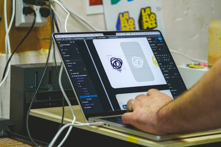 Person designing on a laptop computer screen